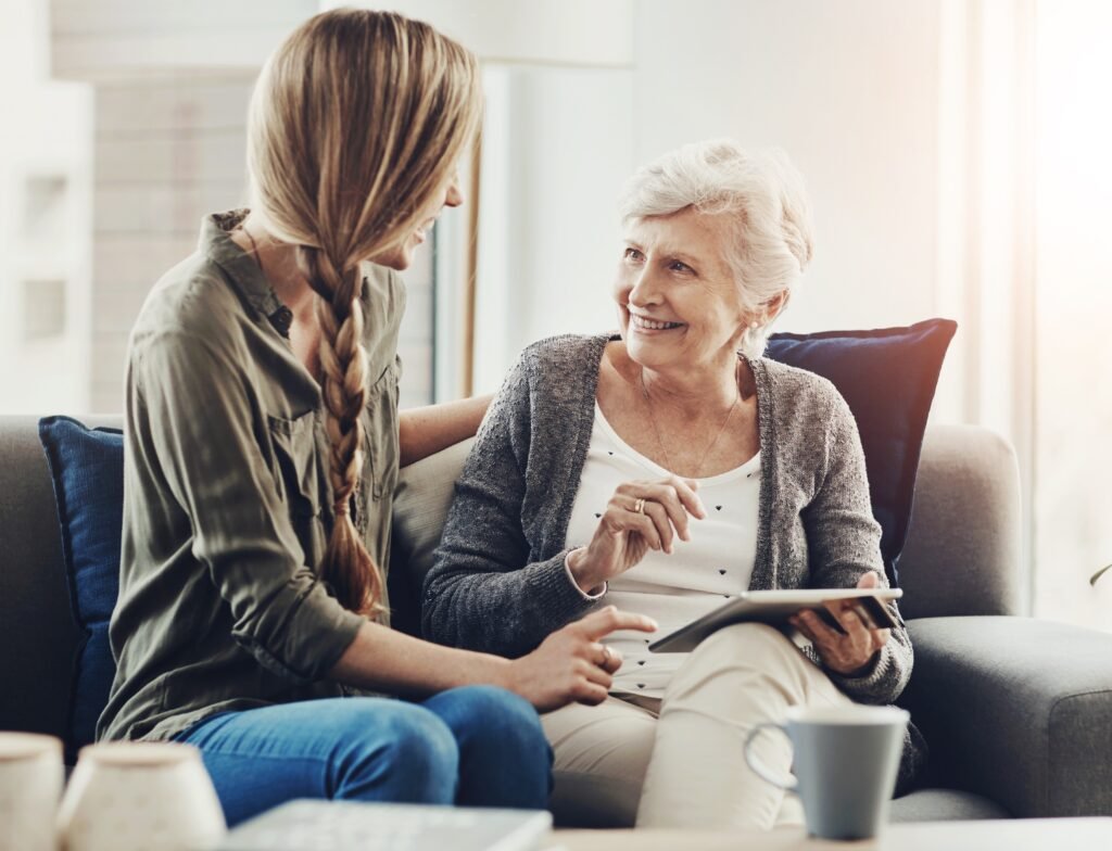 Our Services tablet,,sofa,and,woman,with,senior,mother,in,home,for